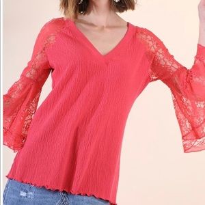 Sheer lace top with wide open sleeves.